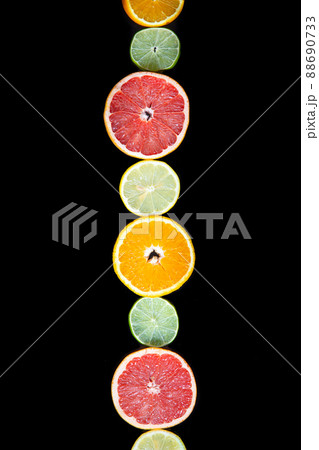 citrus slices, ,orange, lemon, lime, and grapefruit black background. Top view citrus slices, ,orange, lemon, lime, and grapefruit black background. Top view 88690733