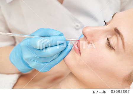 Permanent makeup. Beauty spa procedure. young woman. Face tattoo 88692897