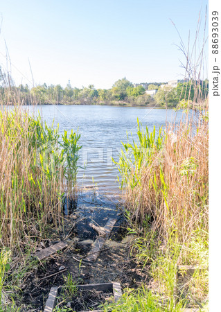 Czarne (Black) Lake at sunny day in Olsztyn, Poland. Czarne (Black) Lake at sunny day in Olsztyn, Poland. 88693039