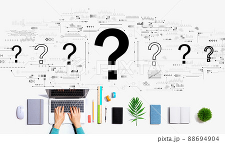 Question marks with person using a laptop 88694904