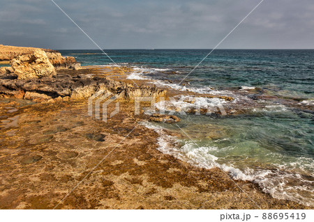Ayia Napa rocky stormy seafront, Cyprus. Ayia Napa rocky stormy seafront, Cyprus. 88695419