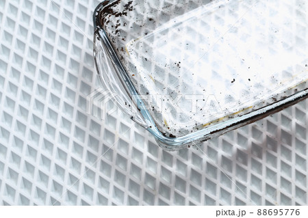 Dirty baking dish with thick layer of carbon 88695776