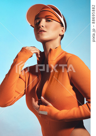 Beautiful attractive woman in a trendy swimsuit with sports equipment and accessories. 88695882