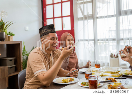 friend having iftar dinner together at home 88696567