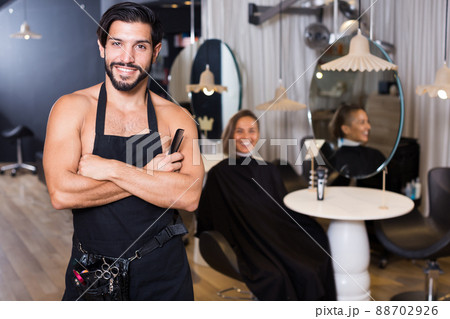male hairdresser and female in beauty salon 88702926
