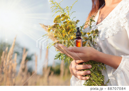 Natural herbal, brown bottle in hand women. MOCK-UP, Copy space. 88707084