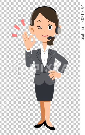 一個戴著耳機和西裝的女人顯示一個好的跡象 一個戴著耳機和西裝的女人顯示一個好的跡象 88710194
