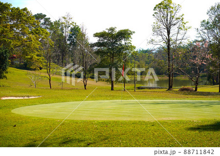 View of Golf Course with beautiful putting green. Golf course with a rich green turf beautiful scenery. View of Golf Course with beautiful putting green. Golf course with a rich green turf beautiful scenery. 88711842