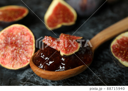 Spoon with fig jam and ingredients on black smokey background Spoon with fig jam and ingredients on black smokey background 88715940