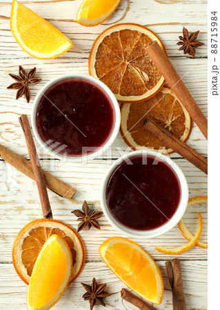 Cranberry sauce and ingredients on white wooden background 88715984