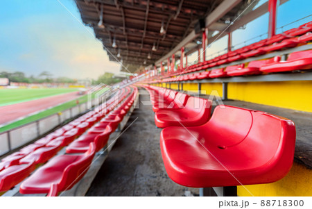Empty red seat on grandstand for fans cheering at football stadium 88718300