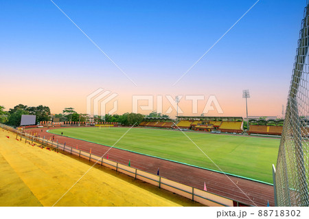 Empty yellow grandstand for fans cheering at football stadium Empty yellow grandstand for fans cheering at football stadium 88718302