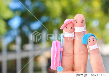 Fingers art of happy family with face mask. Man and woman going on vacation. Fingers art of happy family with face mask. Man and woman going on vacation. 88718460