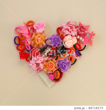 Different hair clips on beige background. Flat lay. Top view. 88718575