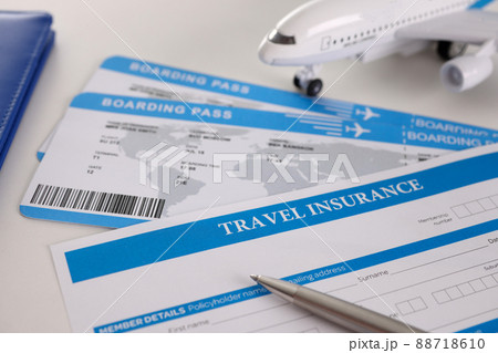 Airplane tickets, empty travel insurance form with pen, fill in information Airplane tickets, empty travel insurance form with pen, fill in information 88718610