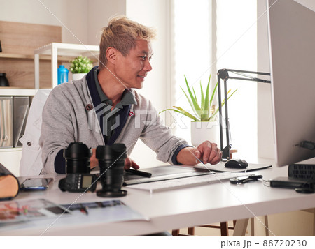 Graphic designer/photographer working in home office 88720230