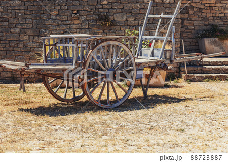 Medieval wooden vehicle  with metal tire on wheel rim ready to move, engineering ideas 88723887