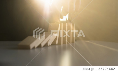 Stopping domino effect with a bright light flare from behind 88724682