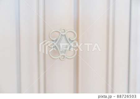 carved retro metal handles on the doors of the wardrobe. carved retro metal handles on the doors of the wardrobe. 88726503