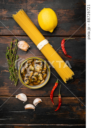 Pasta with mussels raw ingredients , on old dark wooden table background, top view flat lay 88726721