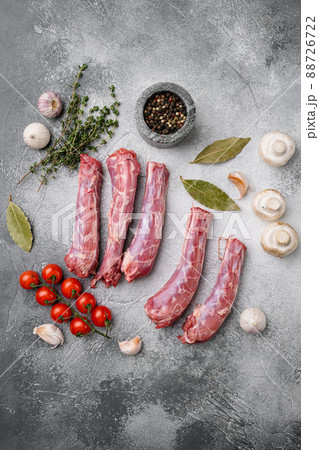 Bird chicken giblets gizzards stomachs, on gray stone table background, top view flat lay, with copy space for text Bird chicken giblets gizzards stomachs, on gray stone table background, top view flat lay, with copy space for text 88726722