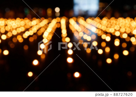 Abstract golden bokeh from candle light on black background. 88727620