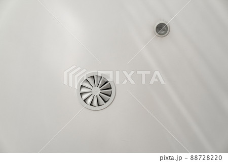 luminaire and diffuser fan on the white ceiling. luminaire and diffuser fan on the white ceiling. 88728220