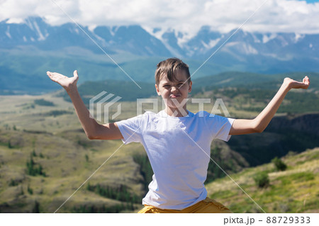 A child funny boy on the Altai mountain background. 88729333