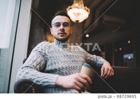 Serious man with cup of coffee 88729605