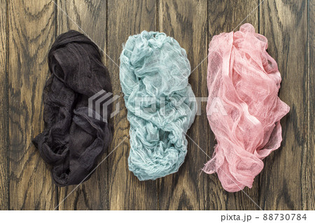Three gauze napkins on wooden background Three gauze napkins on wooden background 88730784
