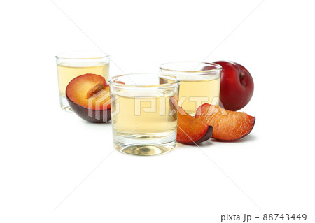 Plum vodka shots isolated on white background 88743449