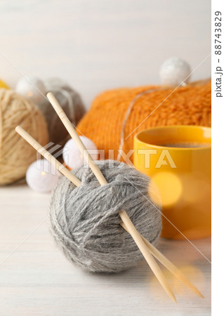 Concept of knitting on white wooden table, close up Concept of knitting on white wooden table, close up 88743829