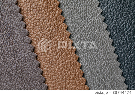 Samples of beige, brown, gray black leather. Leather crafts and craftwork. View from above. Samples of beige, brown, gray black leather. Leather crafts and craftwork. View from above. 88744474