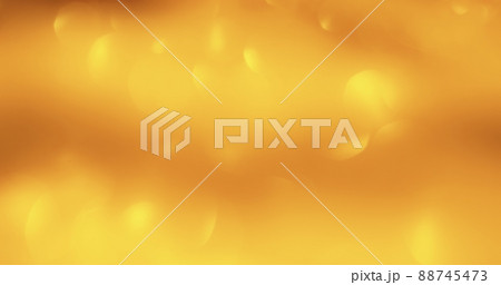 Bokeh glow. Light flare overlay. Sequin reflection. Defocused gold shiny circles glare on orange color gradient abstract background. Bokeh glow. Light flare overlay. Sequin reflection. Defocused gold shiny circles glare on orange color gradient abstract background. 88745473