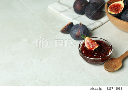 Concept of tasty food with fig jam on white textured background 88746914