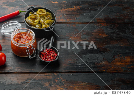 Ingredients for making tomato salsa, on old dark wooden table background with copy space for text 88747340