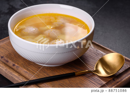 Soup with turkey meatballs, potatoes and vegetables. Selective focus 88751086