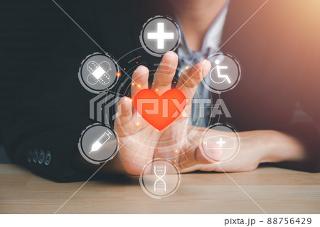 Person hand holding red heart icon on virtual screen, heart health insurance, charity volunteer donation, CSR responsibility, world heart day, world health day, family day, saving lives.... Person hand holding red heart icon on virtual screen, heart health insurance, charity volunteer donation, CSR responsibility, world heart day, world health day, family day, saving lives.... 88756429