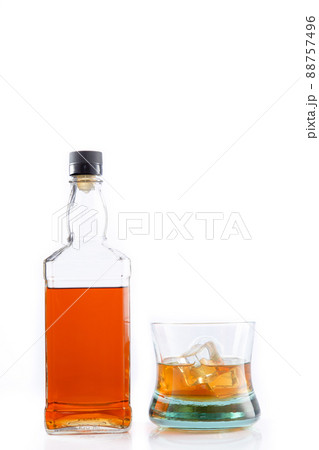 Bottle of whisky and glass of whisky with ice isolated on white background with copy space. Bottle of whisky and glass of whisky with ice isolated on white background with copy space. 88757496