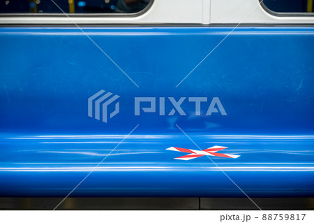 blue seat row in the train with crossed marking tape in Coronavirus (COVID-19) period. It means Social Distancing in transportation. 88759817