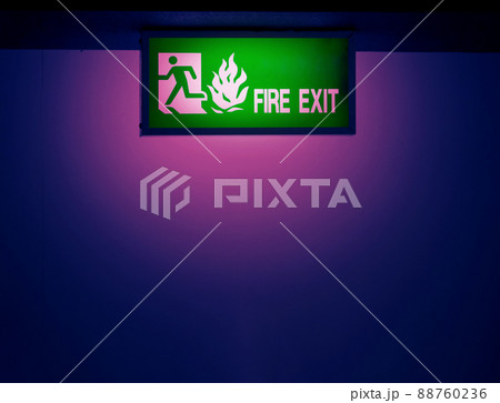 Fire exit door. Fire exit emergency door red color metal material with alarm and emergency light and fire extinguish equipment on building wall for safety protection. Doors for escape conflagration. Fire exit door. Fire exit emergency door red color metal material with alarm and emergency light and fire extinguish equipment on building wall for safety protection. Doors for escape conflagration. 88760236