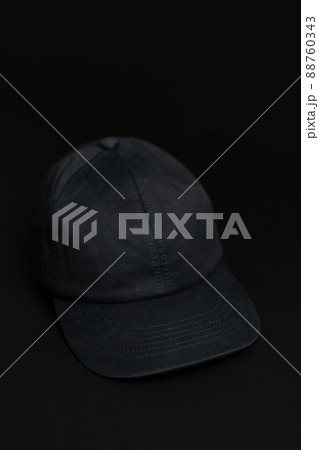 Black cloth cap / hat on the dark black background. Black cloth cap / hat on the dark black background. 88760343