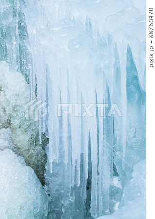 Winter vertical background made of ice, icicles, frozen water drops Winter vertical background made of ice, icicles, frozen water drops 88760470
