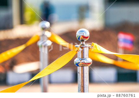 luxury stainless barricade with yellow rope ribbon on road in Marathon event at the finish point. luxury stainless barricade with yellow rope ribbon on road in Marathon event at the finish point. 88760761