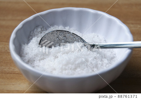 Close up of salt intake with spoon. Healthy food concept Close up of salt intake with spoon. Healthy food concept 88761371