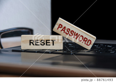 Rest password text on wooden blocks on top of a laptop. Online security and password concept 88761493