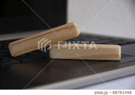 Blank wooden blocks on top of a laptop. Copy space concept 88761498