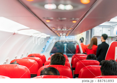 closeup airplane Console panel; lamp, light, need help button, air condition, sefty belt and no smoking lighting sign. closeup airplane Console panel; lamp, light, need help button, air condition, sefty belt and no smoking lighting sign. 88761893