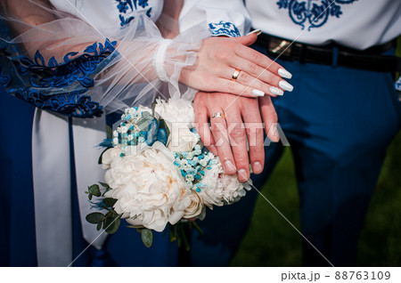 Man and woman holding hands together Man and woman holding hands together 88763109