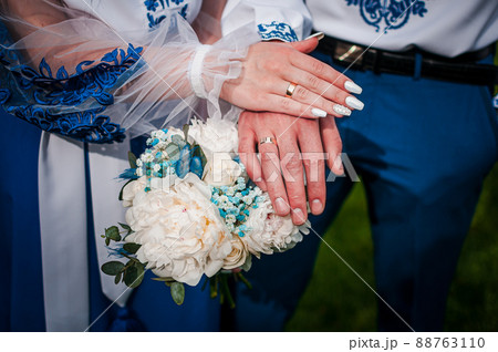 Man and woman holding hands together Man and woman holding hands together 88763110
